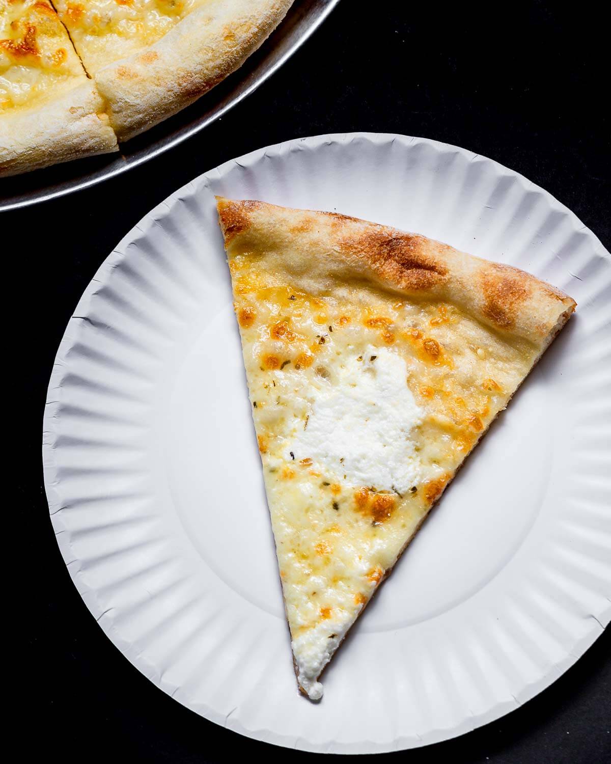 PIZZA FACTORY LOCATED AT LONG ISLAND CITY NY : WHITE WITH SPINACH PIZZA SLICE